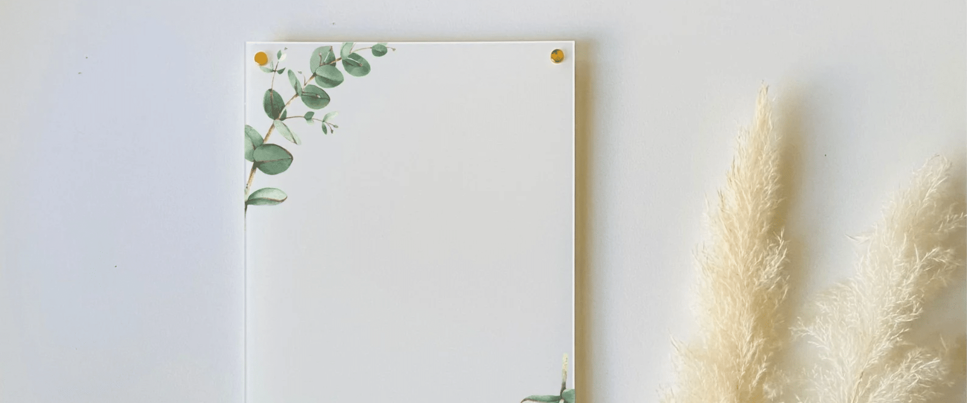Eucalyptus notepad featuring eucalyptus leaves and an acrylic board for wall display.