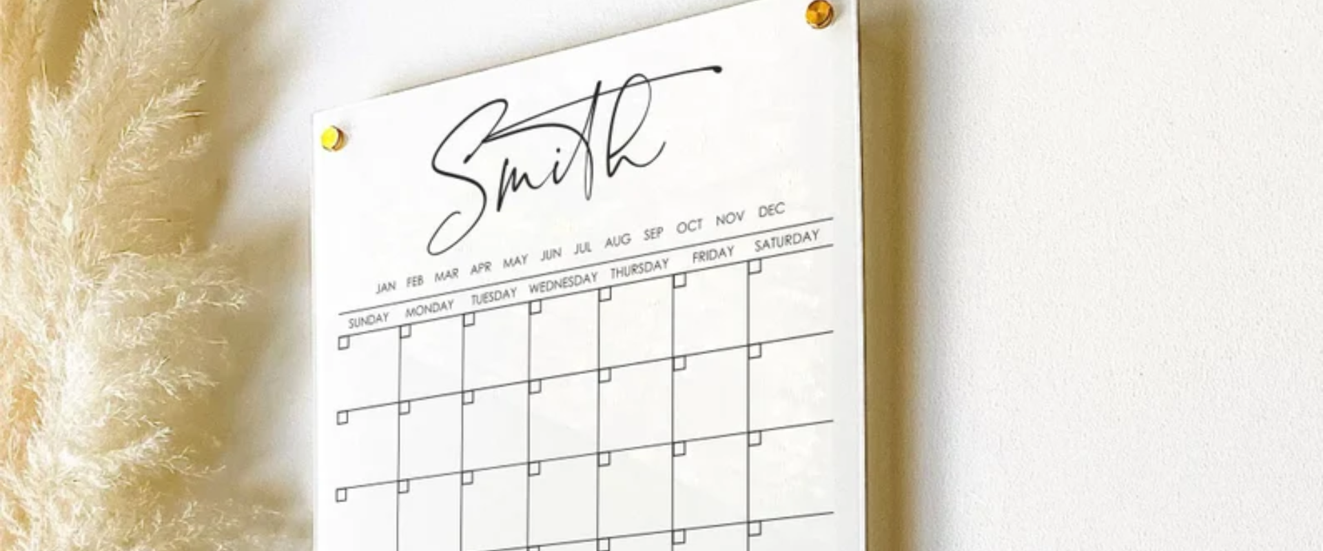 A calendar hanging on a wall with the word smith on it.