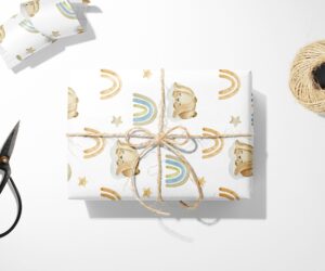Decorative Bunny wrapping paper and scissors on a white surface.