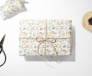 A Bunny and Floral Wrapping Paper with a bow and scissors next to it.