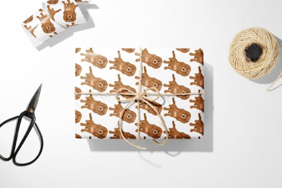 A Spaniel Dog Wrapping Paper with a brown bear on it.