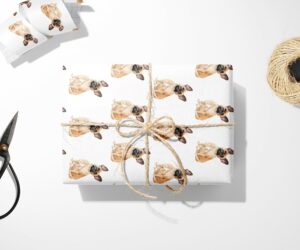 A French Bulldog Wrapping Paper with a Christmas theme on it.