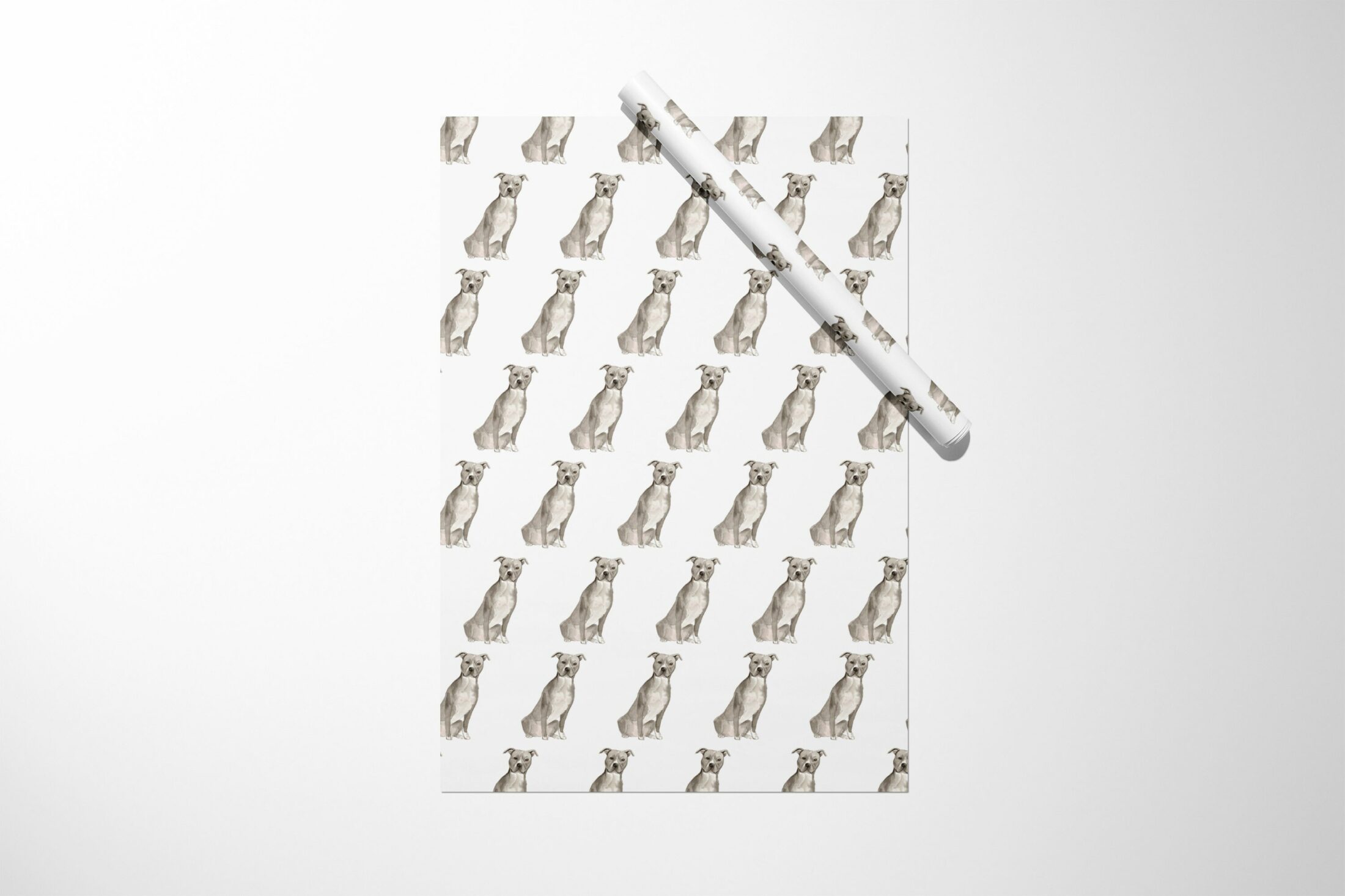 A Staffordshire Terrier wrapping paper with a cat on it.