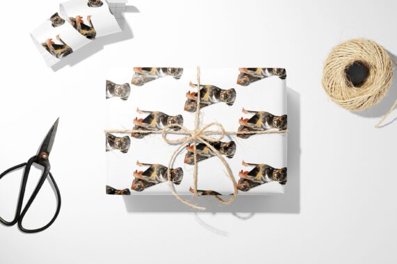 A Christmas Rottweiler Dog Wrapping Paper with a cat on it.