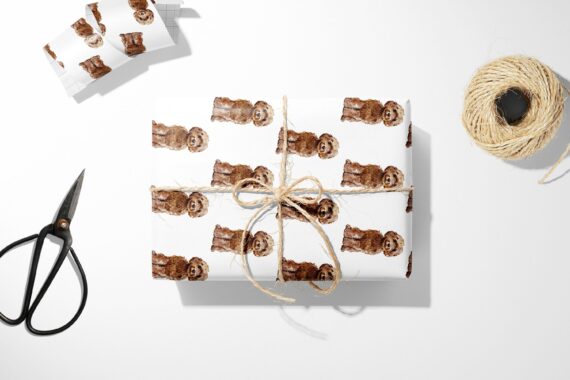 A Brown Labradoodle wrapping paper with scissors and a brown teddy bear.