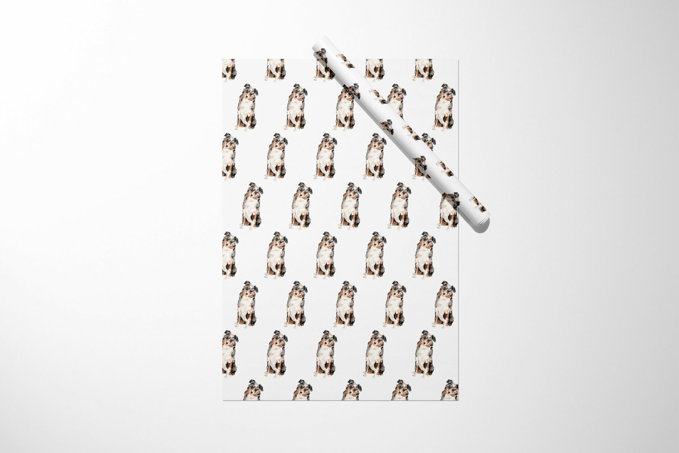 A gift with a Australian Shepherd Dog on wrapping paper.