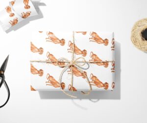 A Hungarian Vizsla Wrapping Paper with scissors and a pair of scissors next to it.