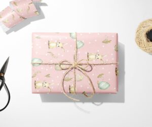 A pink Bunny and Egg wrapping paper with a bunny on it.