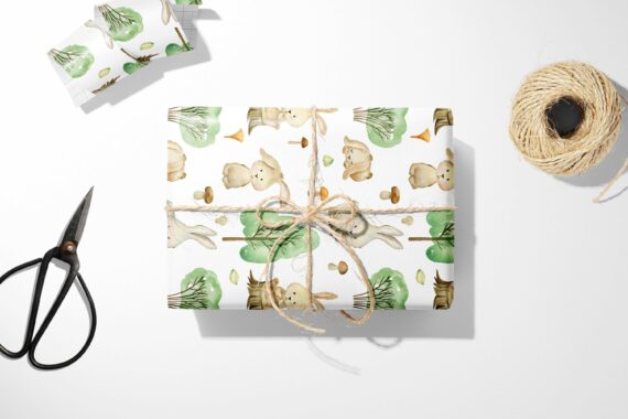 A Bunny and Forest wrapping paper with animals and scissors next to it.
