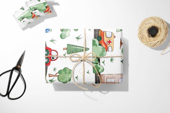 A Cars, Roads, and Town Wrapping Paper with a car design, ready to be cut with a pair of scissors.