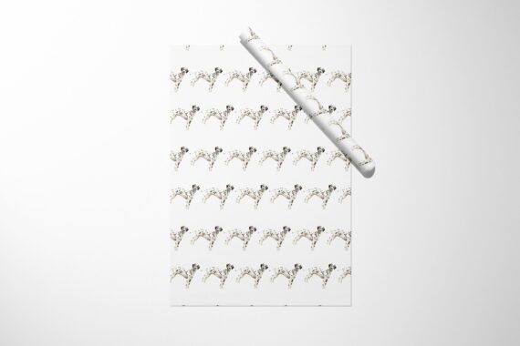 Christmas wrapping paper featuring a stylish black and white Dalmatian dog pattern.