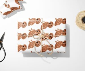 Brown Dog Wrapping Paper and scissors on a white surface, perfect for Christmas gifts.