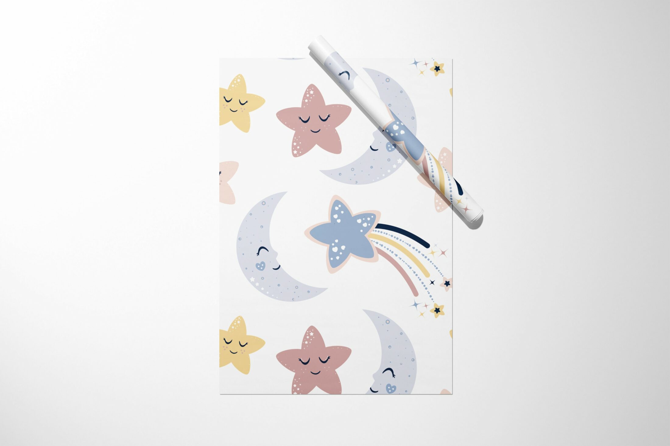 A Moon and Stars Wrapping Paper with stars and moons on it, perfect for Christmas gifting.